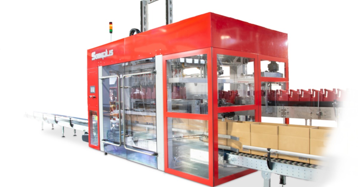 Open cartons are on a conveyor in front of the Scorpius pick-and-place cartoning machine, which has a bright red frame.